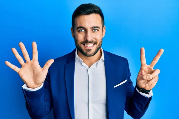 Young Hispanic Businessman Wearing Business Jacket Showing Pointing Fingers Number — Stock Photo, Image