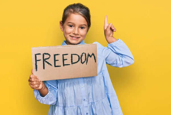 Little Beautiful Girl Holding Freedom Banner Surprised Idea Question Pointing — Stock Photo, Image