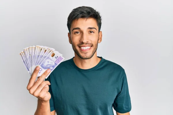 Joven Hombre Guapo Sosteniendo Billetes Coronas Suecas Que Ven Positivos —  Fotos de Stock