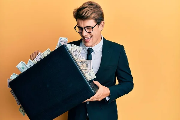 Handsome Caucasian Business Man Holding Briefcase Full Dollars Smiling Laughing — Stok fotoğraf