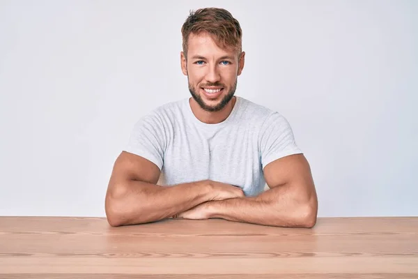 Young Caucasian Man Wearing Casual Clothes Sitting Table Looking Positive — 图库照片