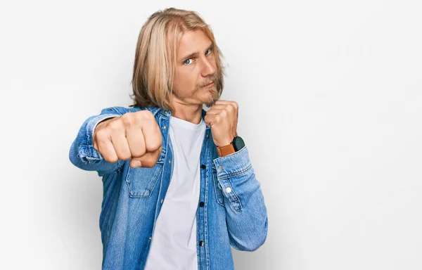 Caucasian Man Blond Long Hair Wearing Casual Denim Jacket Punching — Stock Photo, Image