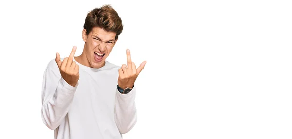 Handsome Caucasian Man Wearing Casual White Sweater Showing Middle Finger — Stock Fotó