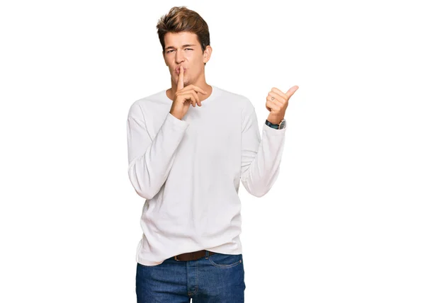 Handsome Caucasian Man Wearing Casual White Sweater Asking Quiet Finger — Fotografia de Stock
