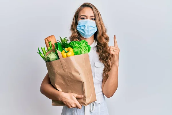 Young Blonde Girl Wearing Medical Mask Holding Paper Bag Groceries — 스톡 사진