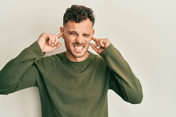 Young Hispanic Man Wearing Casual Clothes Covering Ears Fingers Annoyed — Stock Photo, Image