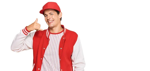 Handsome Caucasian Man Wearing Baseball Uniform Smiling Doing Phone Gesture — 스톡 사진