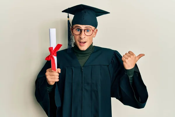 Young Caucasian Man Wearing Graduation Cap Ceremony Robe Holding Diploma — Stockfoto