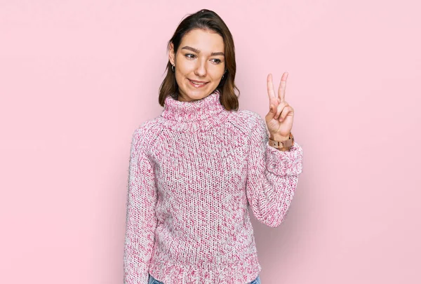 Young Caucasian Girl Wearing Wool Winter Sweater Showing Pointing Fingers — Foto Stock