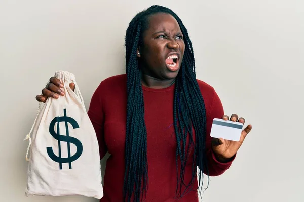 Young Black Woman Braids Holding Dollars Bag Credit Card Angry — Stock Photo, Image