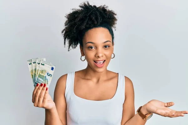 Young African American Girl Holding Euro Banknotes Celebrating Achievement Happy — Stockfoto