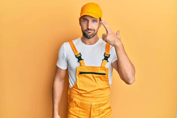 Young Handsome Man Wearing Handyman Uniform Yellow Background Shooting Killing — Stockfoto