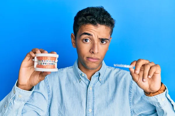 Young Handsome African American Man Holding Invisible Aligner Orthodontic Braces — Stock Photo, Image