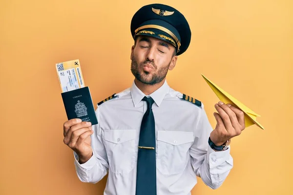 Handsome Hispanic Pilot Man Holding Paper Plane Passport Looking Camera — Stock Photo, Image