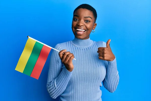 Young African American Woman Holding Lithuania Flag Smiling Happy Positive — Stock Photo, Image