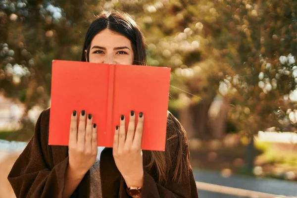 Young Hispanic Woman Smiling Happy Covering Face Book City — Stock Photo, Image