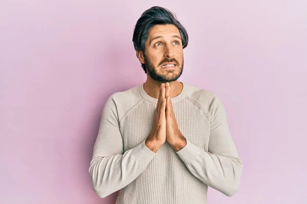 Young Hispanic Man Wearing Casual Winter Sweater Begging Praying Hands — Stock Photo, Image