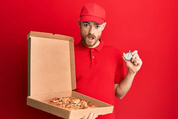 Young Redhead Man Wearing Delivery Uniform Holding Pizza Box Countdown — Stock Fotó