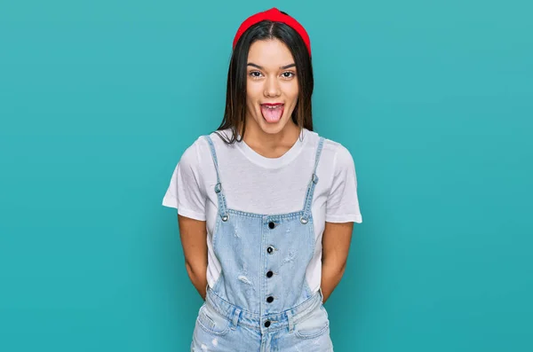 Young Hispanic Girl Wearing Casual Clothes Sticking Tongue Out Happy — Stock Photo, Image