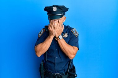 Middle age handsome man wearing police uniform rubbing eyes for fatigue and headache, sleepy and tired expression. vision problem 