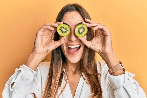 Young Beautiful Woman Holding Slice Kiwi Eyes Celebrating Crazy Amazed — Stock Photo, Image