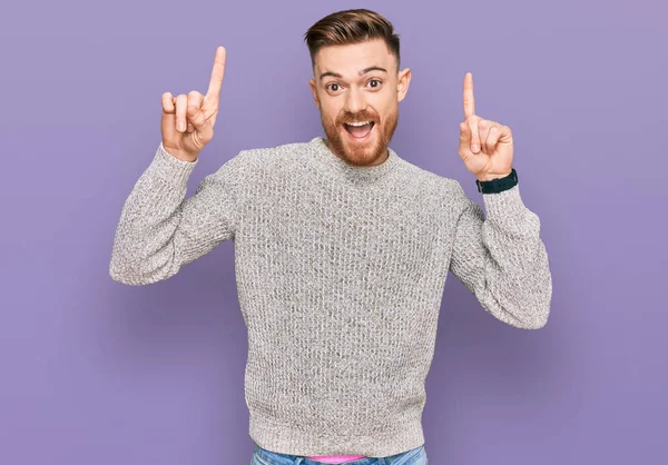 Young Redhead Man Wearing Casual Winter Sweater Smiling Amazed Surprised — Stockfoto