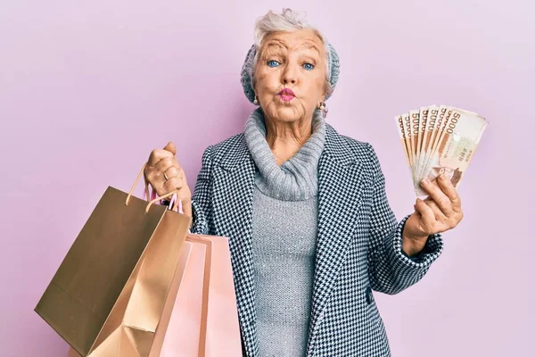 Senior Grey Haired Woman Holding Shopping Bags South Korea Won — Foto de Stock