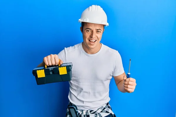 Bonito Jovem Segurando Caixa Ferramentas Chave Fenda Sorrindo Rindo Duro — Fotografia de Stock