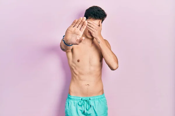 Young Hispanic Man Wearing Swimwear Shirtless Covering Eyes Hands Doing — Stock Photo, Image