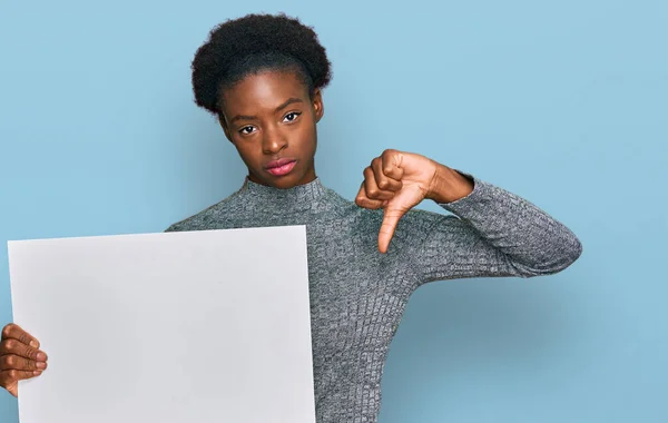 Young African American Girl Holding Blank Empty Banner Angry Face — Stock Photo, Image