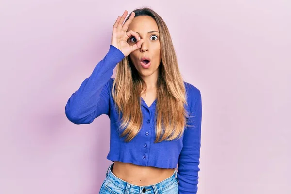 Beautiful Hispanic Woman Wearing Casual Blue Shirt Doing Gesture Shocked — Stock Photo, Image