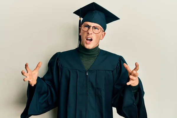 Young Caucasian Man Wearing Graduation Cap Ceremony Robe Crazy Mad — Stock Photo, Image
