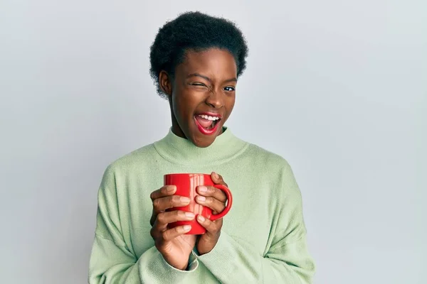 Young African American Girl Drinking Cup Coffee Winking Looking Camera — Stock fotografie