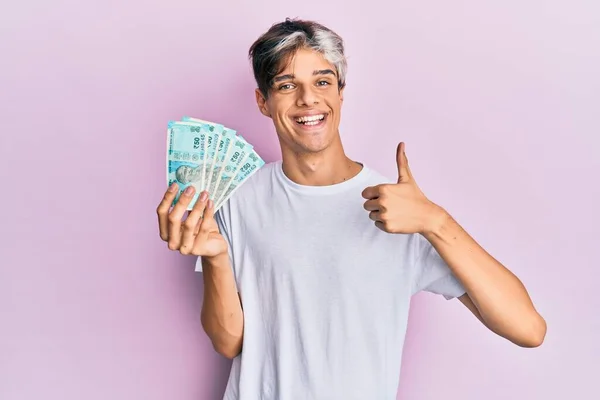 Young Hispanic Man Holding Indian Rupee Banknotes Smiling Happy Positive — Stock Photo, Image