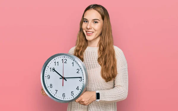 Young Blonde Woman Holding Big Clock Looking Positive Happy Standing — 图库照片