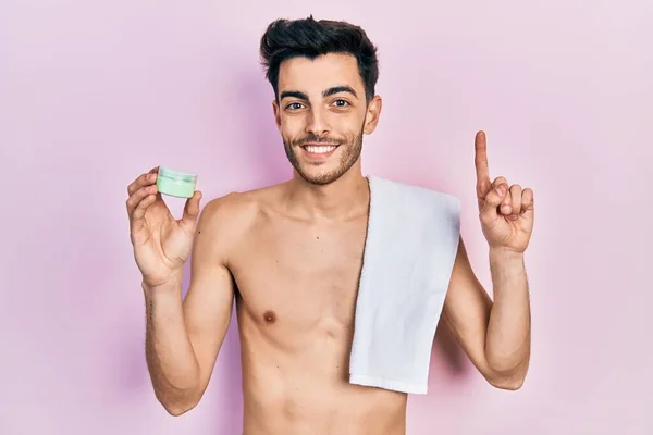 Young Hispanic Man Shirtless Wearing Towel Eye Bags Patches Surprised — 图库照片