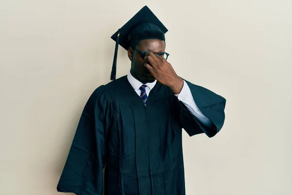 Handsome Black Man Wearing Graduation Cap Ceremony Robe Tired Rubbing — Stock Photo, Image
