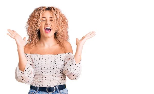 Young Blonde Woman Curly Hair Wearing Casual Clothes Celebrating Mad — 스톡 사진