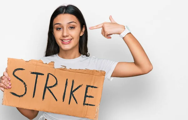 Young Hispanic Girl Holding Strike Banner Cardboard Pointing Finger One — Stock Photo, Image