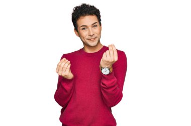 Genç ve yakışıklı bir adam gündelik giysiler giyer. Elleriyle jest yapar. Maaş ister, milyoner işi ister. 