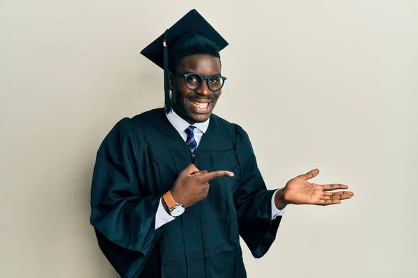 Handsome Black Man Wearing Graduation Cap Ceremony Robe Amazed Smiling — Stock Photo, Image