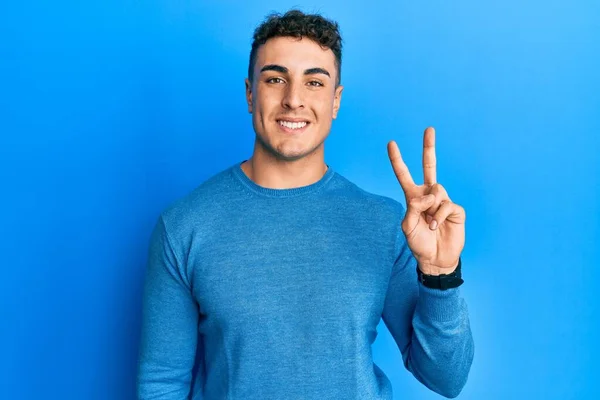 Hispanic Young Man Wearing Casual Winter Sweater Showing Pointing Fingers — Stock Photo, Image