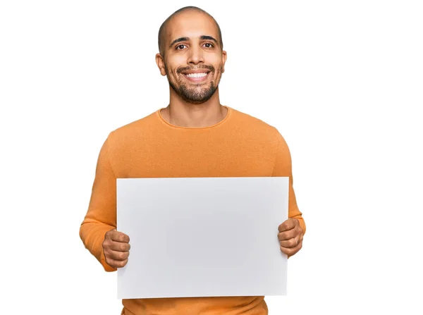 Hispanic Adult Man Holding Blank Empty Banner Looking Positive Happy — Stock Photo, Image