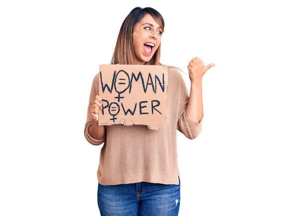 Young Beautiful Woman Holding Woman Power Banner Pointing Thumb Side — 스톡 사진