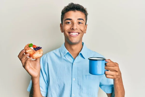 Young Handsome African American Man Drinking Coffee Eating Pastry Smiling — Stock Photo, Image