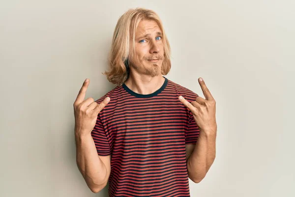 Caucasian Young Man Long Hair Doing Rock Gesture Skeptic Nervous — Stock Photo, Image