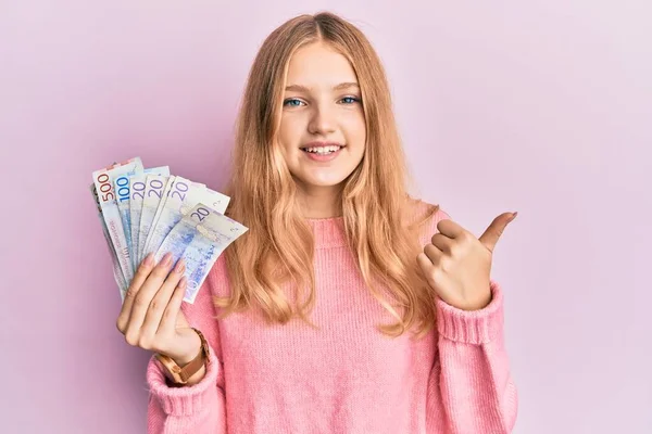 Beautiful Young Caucasian Girl Holding Swedish Krona Banknotes Smiling Happy — Stock Photo, Image