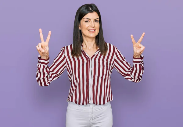 Beautiful Brunette Woman Wearing Striped Shirt Smiling Looking Camera Showing — Stock Photo, Image