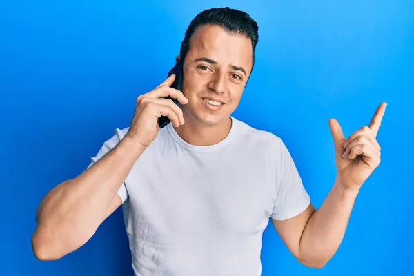 Handsome Young Man Having Conversation Talking Smartphone Smiling Happy Pointing — Stock Photo, Image