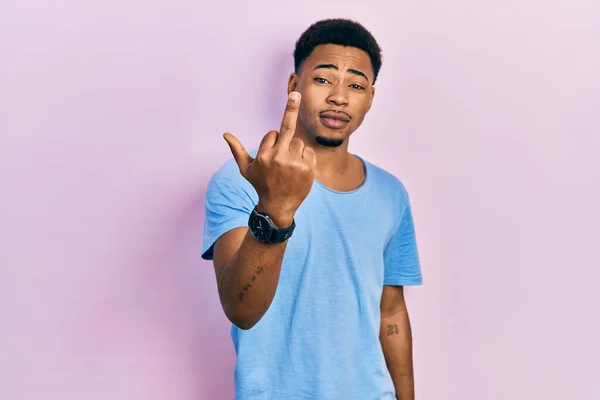 Young African American Man Wearing Casual Blue Shirt Showing Middle — Stockfoto